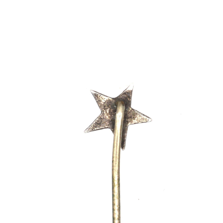Victorian silver star tie pin featuring a turquoise center, symbolizing love and remembrance.
