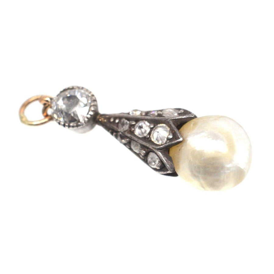 Antique Victorian pendant featuring a natural saltwater pearl and diamond accents on a delicate design.