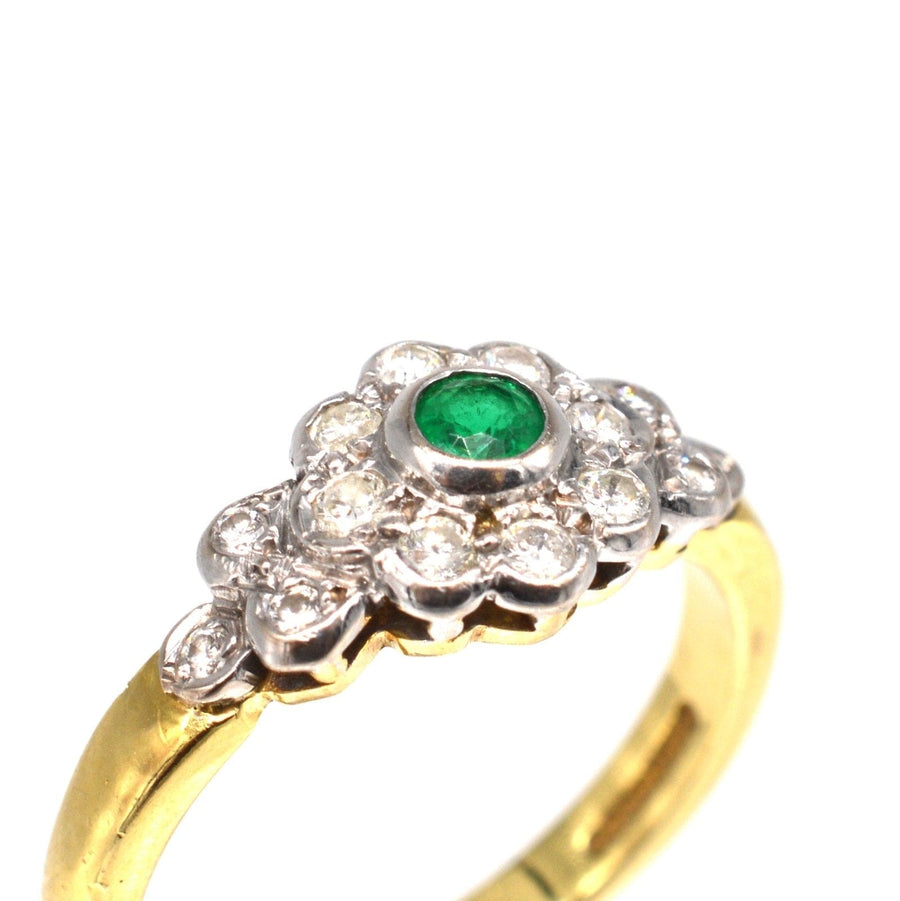 Vintage 18ct gold emerald and diamond cluster ring with diamond shoulders, ideal for engagement or May birthdays.