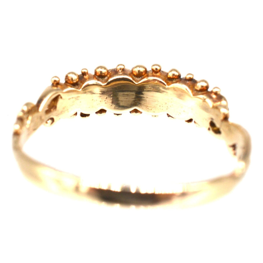 Vintage 9ct gold acrostic ring featuring vibrant gemstones spelling 'REGARD'.