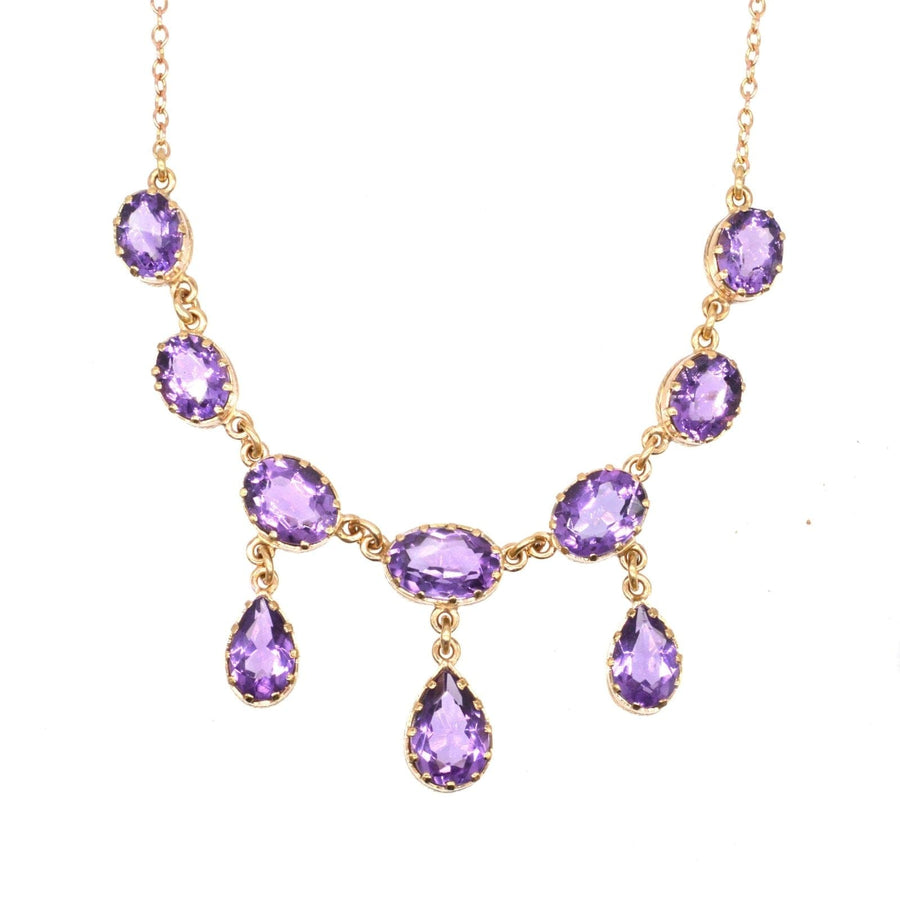 Vintage 9ct gold necklace featuring ten luxurious purple amethyst drops for an elegant look.