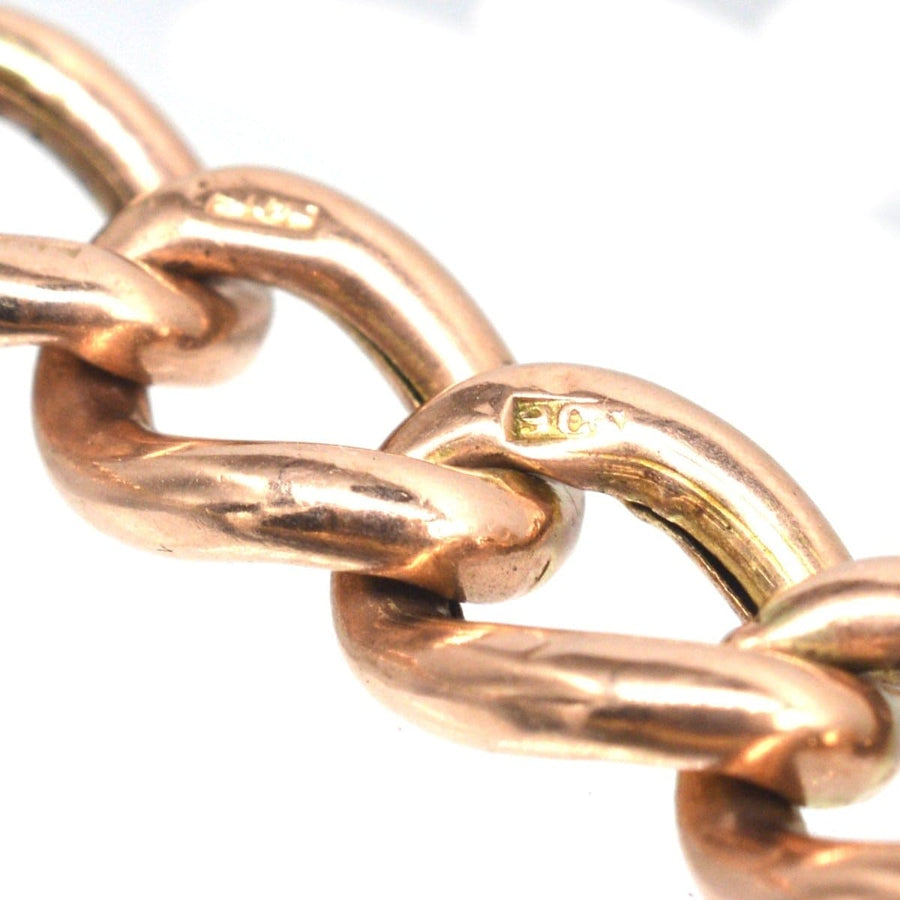 Close-up of vintage 9ct gold curb bracelet links highlighting hallmark details