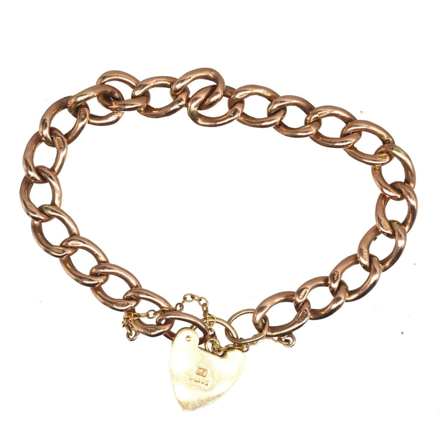 Vintage 9ct gold curb bracelet with heart lock, hallmark and safety chain, perfect for everyday wear.