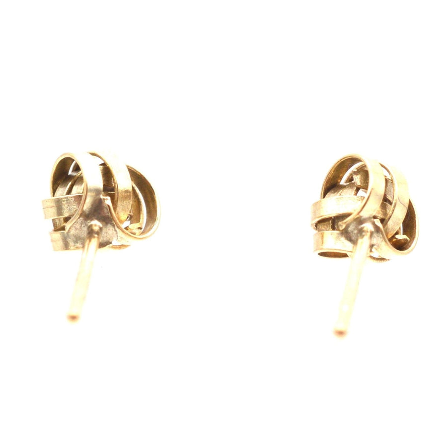 Vintage 9ct gold knot stud earrings from the 1970s-1980s, elegant design for versatile day and evening wear.