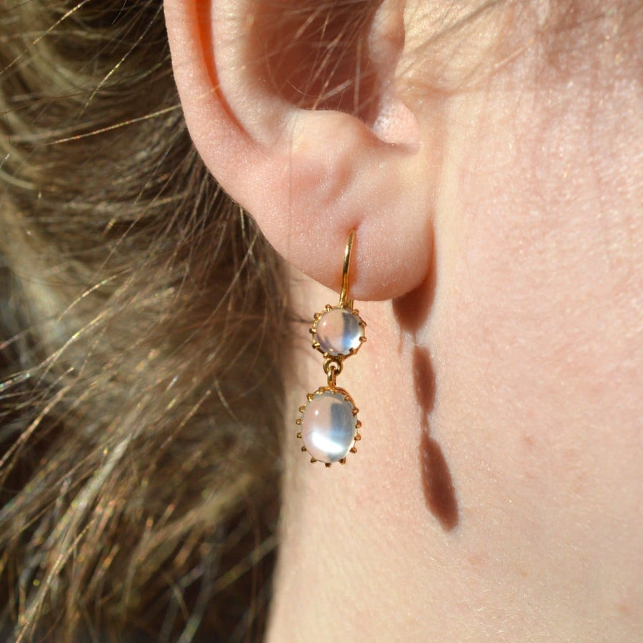 Vintage 9ct gold moonstone drop earrings with round and oval moonstones displaying grey/blue flashes.
