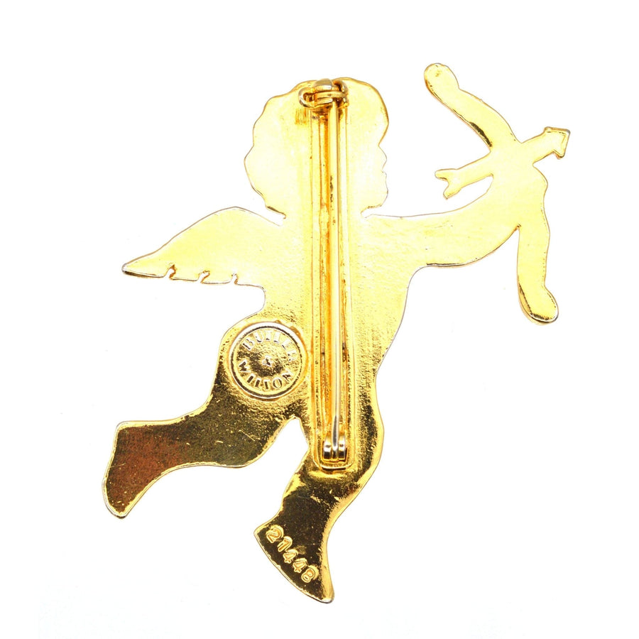 Vintage gold-tone Cupid brooch featuring an angelic figure with a bow and arrow, symbolizing love and desire.