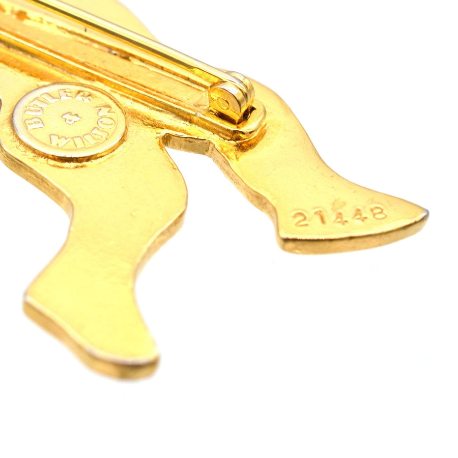 Close-up of the back of a Vintage Butler & Wilson gold-tone Cupid brooch, featuring a secure clasp.
