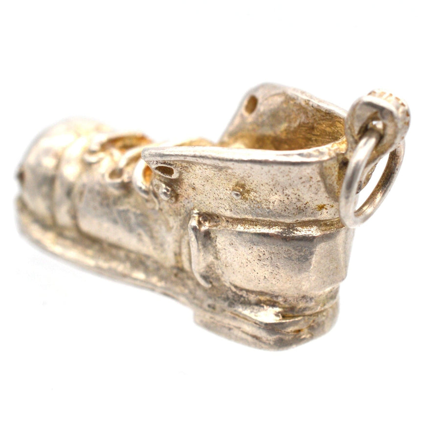 Vintage silver boot pendant charm, 1970s design, showcasing a detailed boot shape, perfect for jewelry enthusiasts.