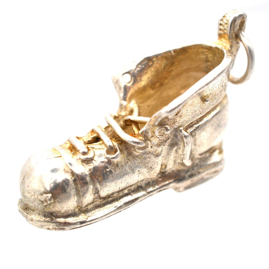Vintage silver boot pendant charm, detailed design with laces, perfect for collectors and fashion enthusiasts.