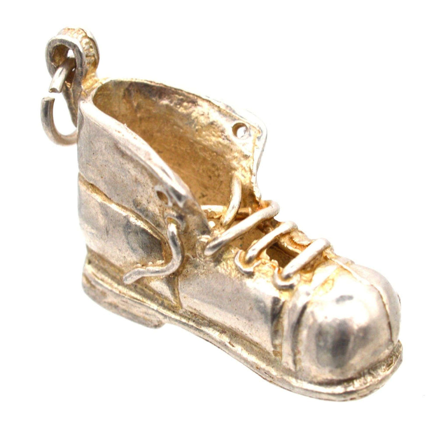 Vintage silver boot pendant charm from the 1970s, ideal for fashion enthusiasts and collectors.